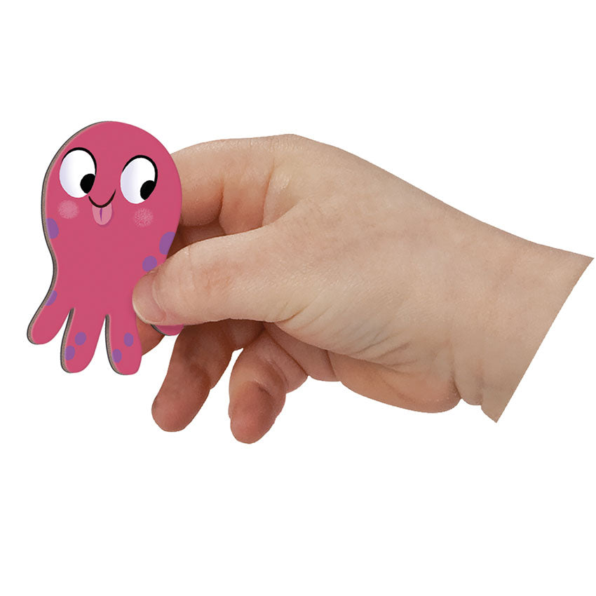 Hand holding a pink octopus-shaped object against a white background