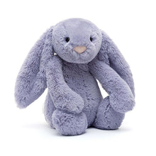 A soft violet furry stuffed bunny with a pink suedette nose and floppy ears.