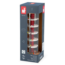 Boxed rainstick toy with a red and white design on a white background