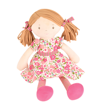 A 40cm rag doll with chocolate brown hair, wearing a floral dress and pink boots, suitable for all ages.