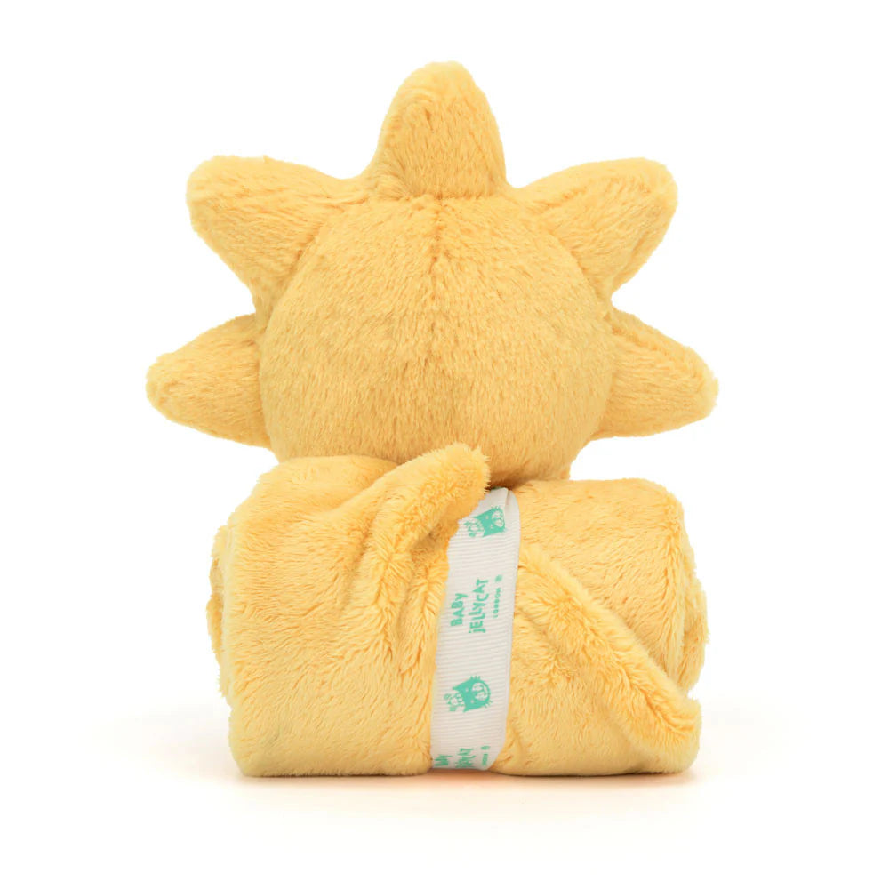 A plush toy in the shape of a sun , wrapped in a soft, yellow blanket with a Baby Jellycat grosgrain ribbon.