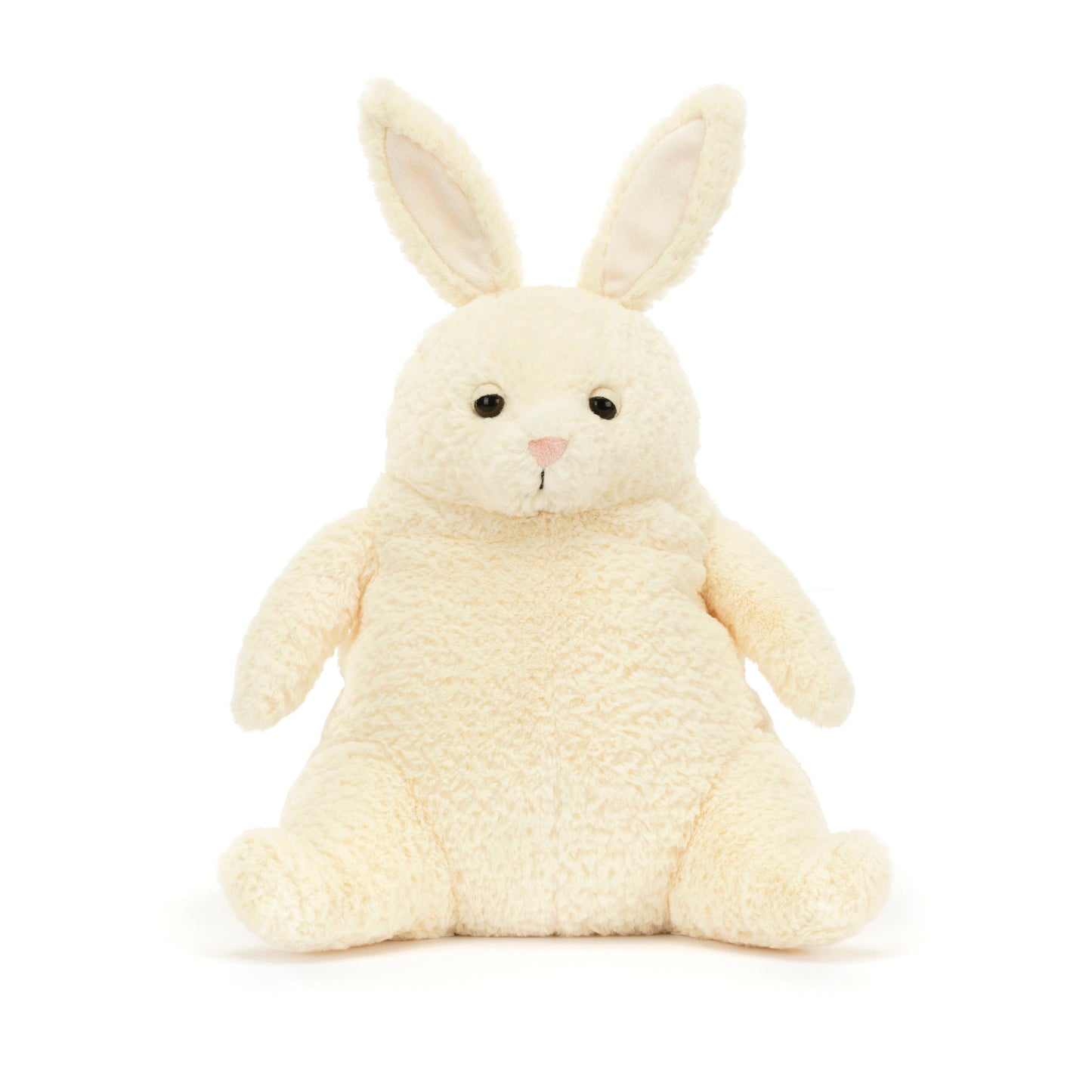 A plush cream-colored bunny with perky ears and a sleepy eye expression, designed by Jellycat.