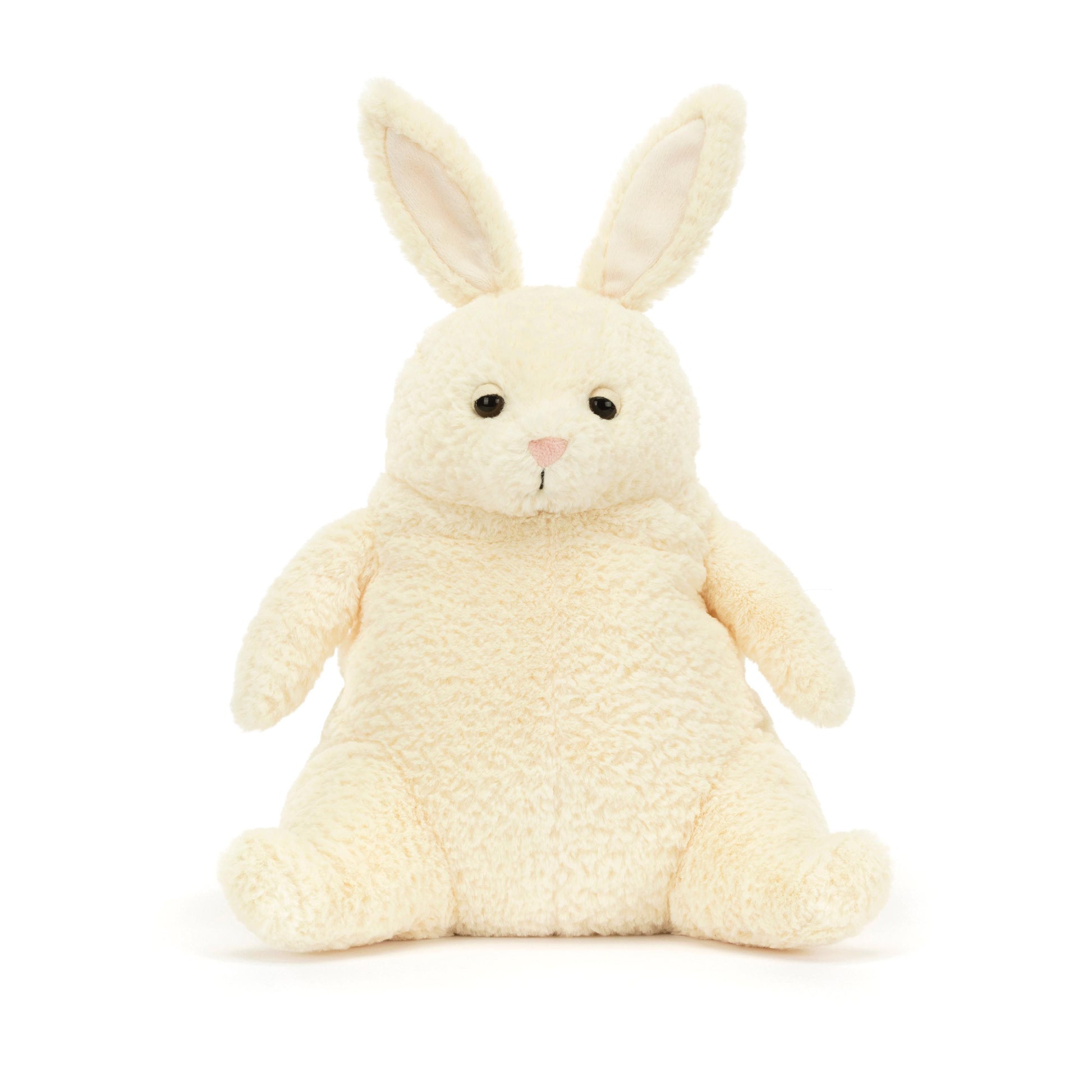 A plush cream-colored bunny with perky ears and a sleepy eye expression, designed by Jellycat.