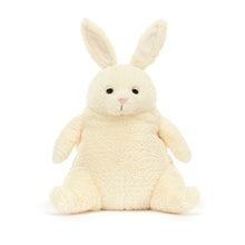 A plush cream-colored bunny with perky ears and a sleepy eye expression, designed by Jellycat.