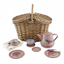 Children's musical tin teaset with a wicker basket, including a tea pot, two cups and saucers, two plates, two spoons, and a picnic cloth, all with pink and yellow floral designs.
