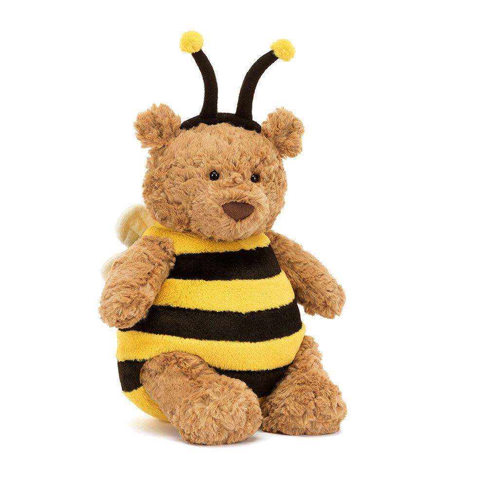 Stuffed toy bear dressed as a bee on a white background