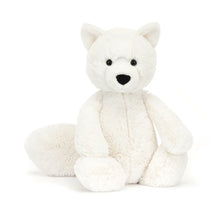 A plush toy resembling a white Arctic fox with a soft cream-colored fur, chunky tail, and pointed ears.