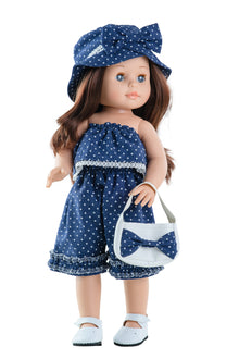 A 42cm vinyl doll with long, wavy chestnut hair and blue-grey eyes, wearing a navy-blue summer outfit with a hat and handbag.
