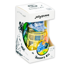 Clear plastic sensory jar filled with under-the-sea themed trinkets for sensory play