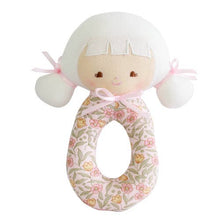 A beige and pink floral-patterned Audrey Grab Rattle with a circular handle and two bumper bumps.
