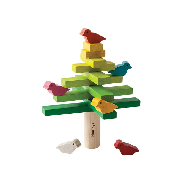 Colorful wooden toy tree with birds on a white background