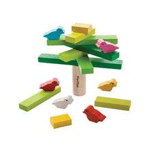 Colorful wooden toy set with birds and a tree on a white background