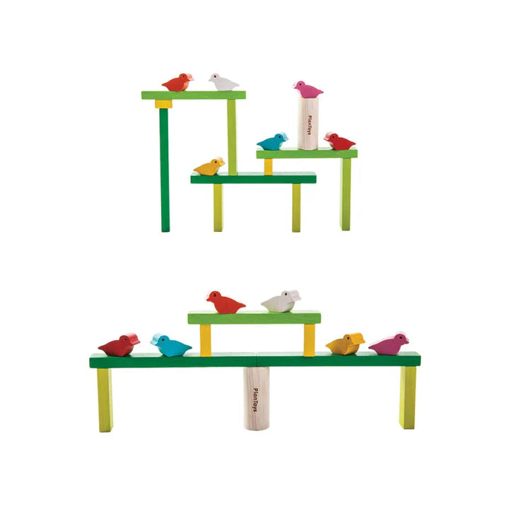 Colorful bird toy set on a white background