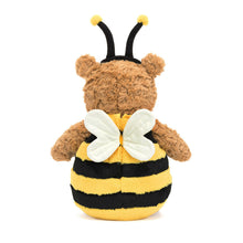 Plush toy bear dressed as a bee with yellow and black stripes on a white background