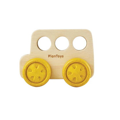 Natural wooden bus toy with yellow wheels and round windows 