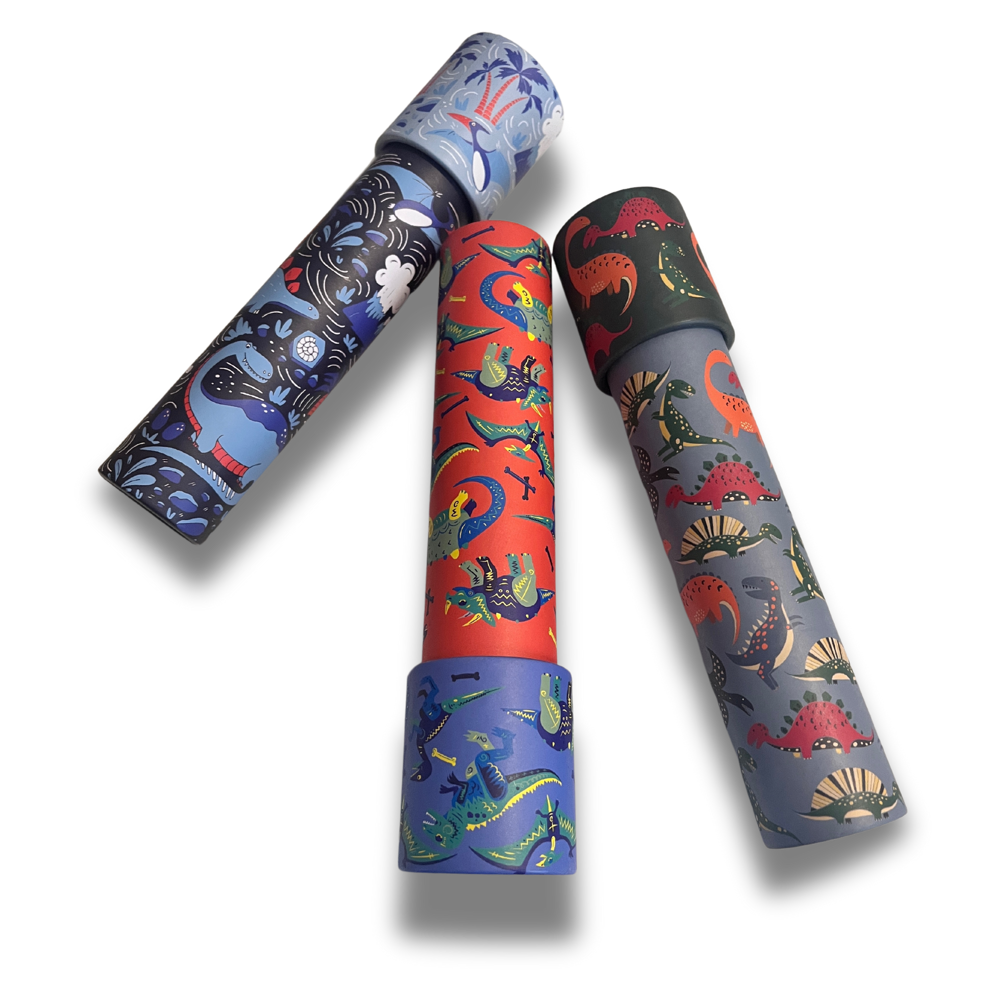 A set of three dinosaur-themed kaleidoscopes in blue, red, and gray, each with various illustrated dinosaurs on the exterior.