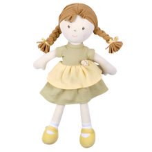 A soft honey-colored cotton rag doll with a summer dress and matching bows in her hair.