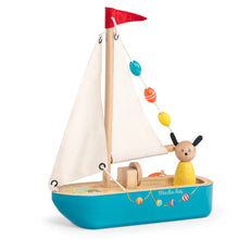 Toy sailboat with a character on a white background