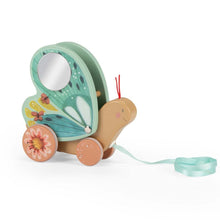 A wooden pull-along butterfly toy with a mirror, bell, and wheels, painted in bright colors with a pull-string mechanism.