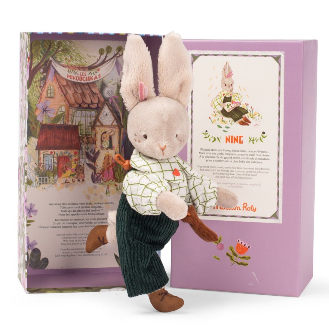 A soft toy rabbit doll in a shirt and pants, with a bow tie, standing in front of an illustrated gift box.