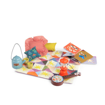 Colorful play mat with toys and books on a white background