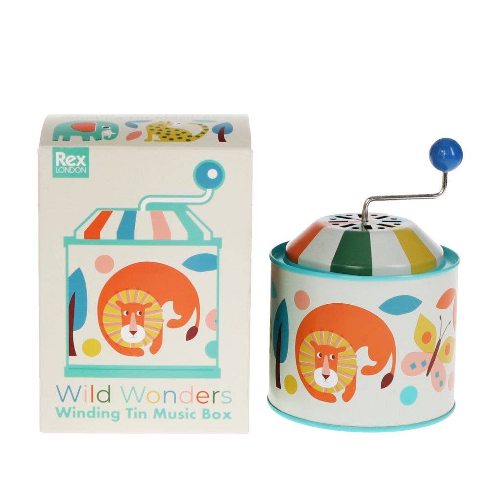 A traditional tin music box with a handle on top, featuring colorful animal illustrations and the text 'Wild Wonders Winding Tin Music Box'.