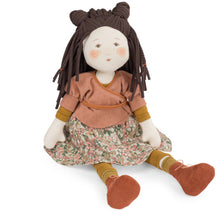 A traditional style Marjolaine rag doll with a floral dress, brown hair in pigtails, and orange shoes.