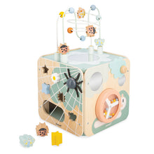 A large, multicolored activity cube for children, featuring various playful elements such as mirrors, abacus, maze, shape sorters, and a magnetic spider on a web design.
