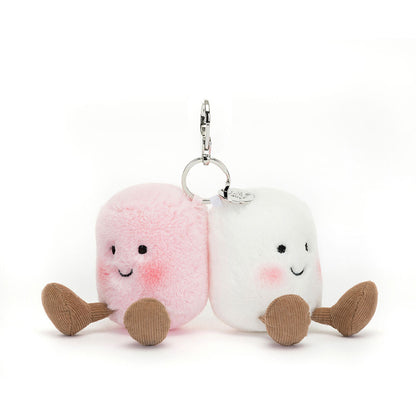 White and pink marshmallow plushies with rosy cheeks, smiling face, brown corduroy legs, sitting, keychain attached on top