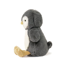 Plush toy penguin with gray body and white belly on a white background