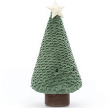 A plush blue spruce Christmas tree with a smiling face, a star on top, and a brown base.