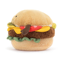 A soft toy designed to look like a hamburger with various fillings and brown cordy arms.