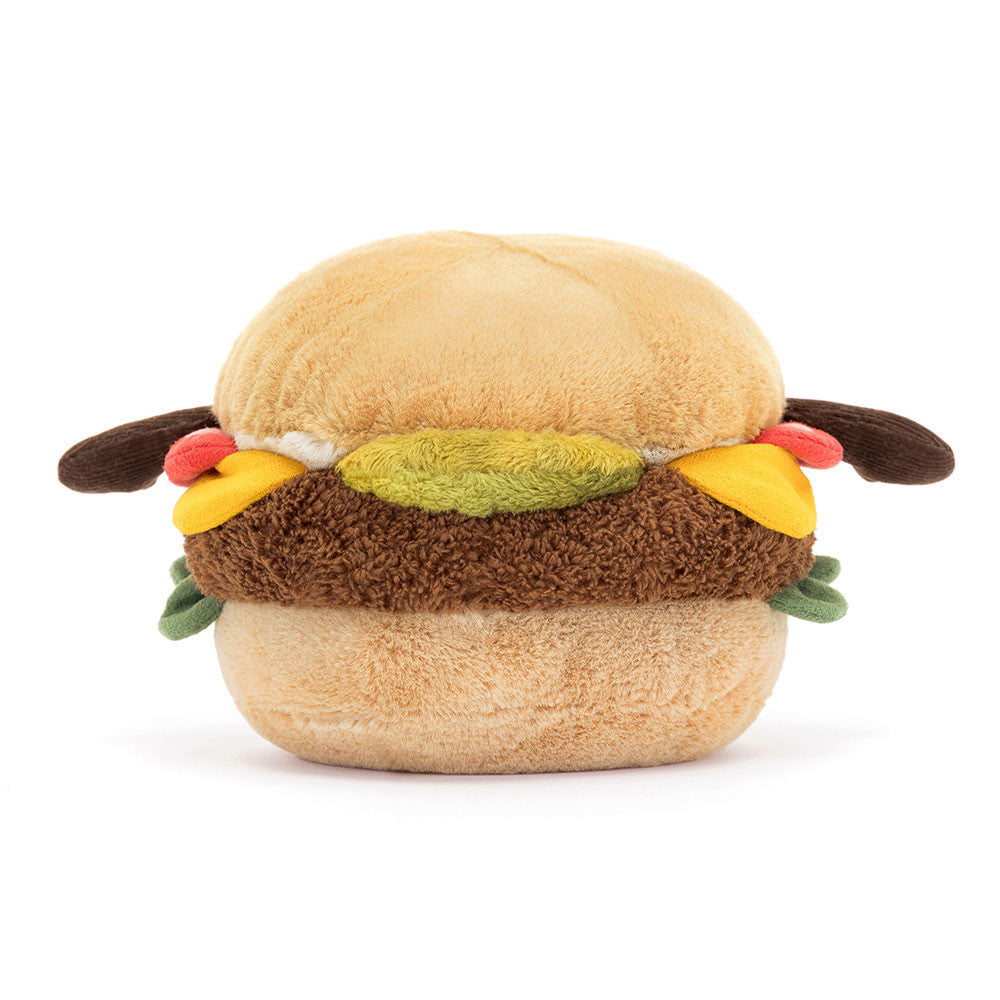 A soft toy designed to look like a hamburger with various fillings and brown cordy arms.