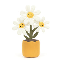 A plush toy depicting a yellow flower with a smiling face, inserted into a yellow pot.