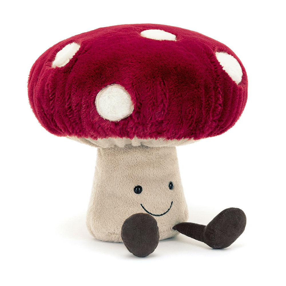 A plush toy mushroom with a red cap with white spots, a beige stalk, and brown boots.