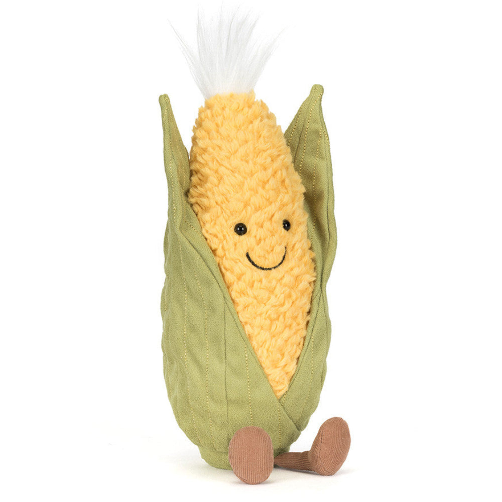 Jellycat plush toy resembling a corn on the cob with a smiling face on a white background