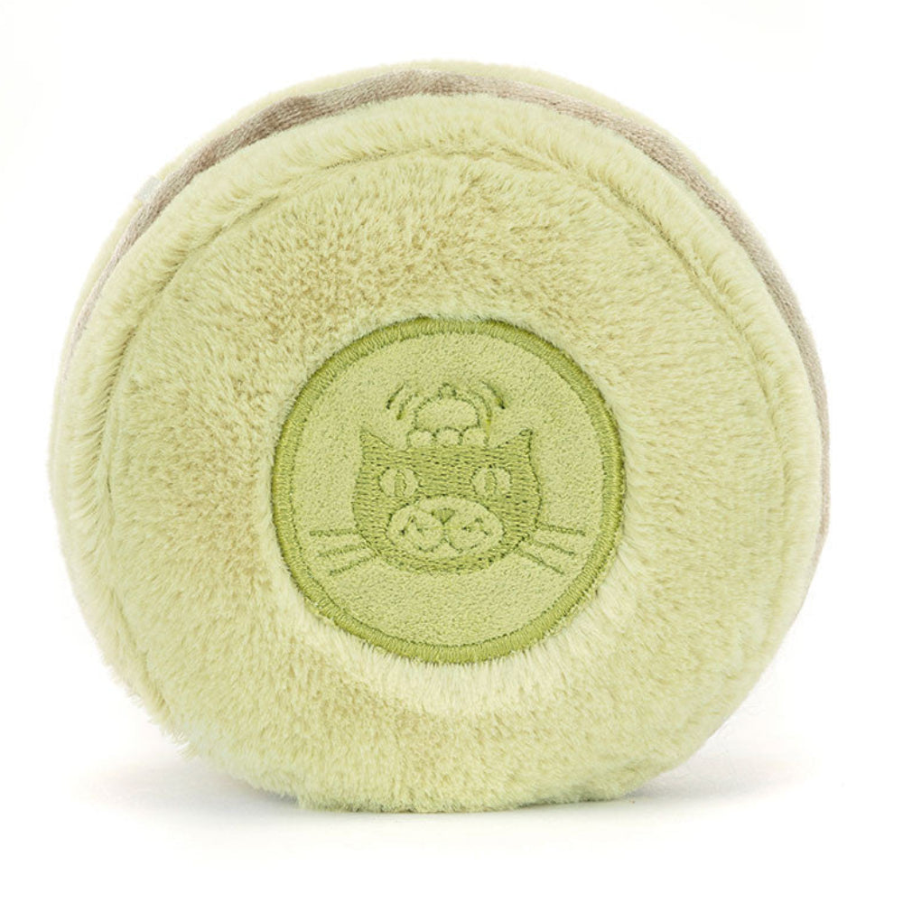 Light green plush ball resembling a macaroon with a Jellycat logo on a white background