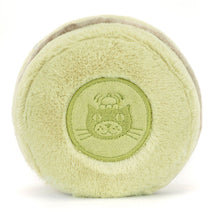 Light green plush ball resembling a macaroon with a Jellycat logo on a white background