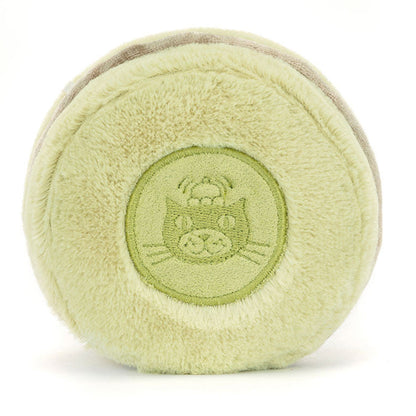 Light green plush ball resembling a macaroon with a Jellycat logo on a white background
