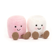Two plush toys resembling marshmallows, one pink and one white, with smiling faces on a white background