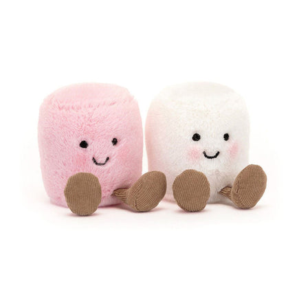 Two plush toys resembling marshmallows, one pink and one white, with smiling faces on a white background