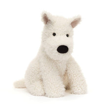 A plush toy resembling a white Scottie dog with a black nose and ears, sitting upright.
