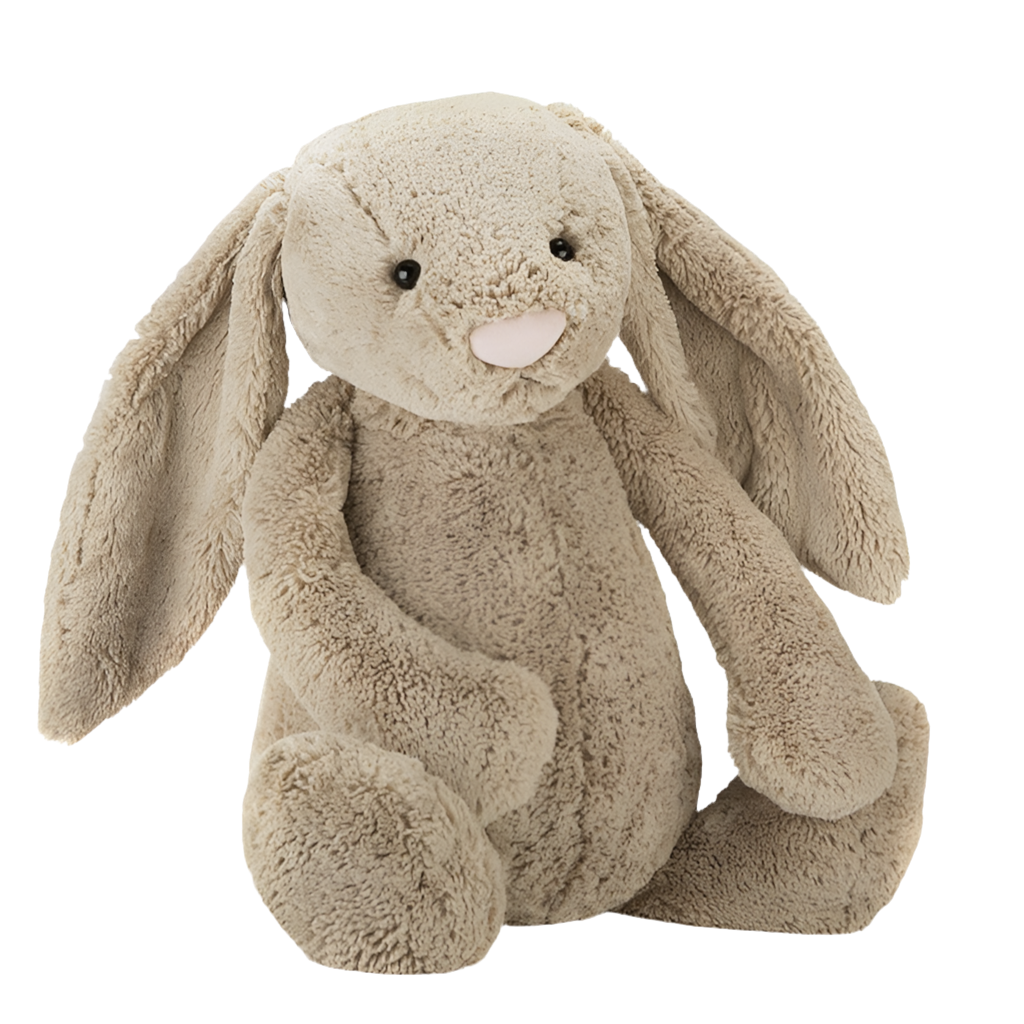 A beige plush toy rabbit with a soft texture, sitting upright.