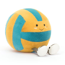 A plush toy resembling a beach volleyball with yellow and blue segments and a smiling face.