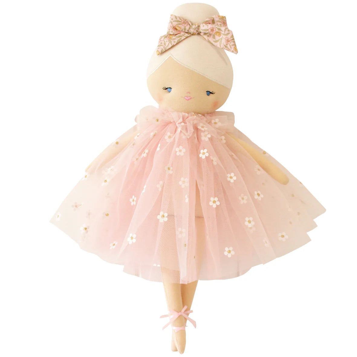 Doll with a pink dress and bow on a white background