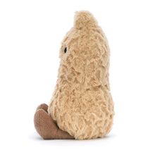 Plush toy resembling a peanut on a white background