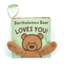 Fabric activity book with a illustration of a bear saying 'Bartholomew Bear LOVES YOU!' with soft golden paws extended, suitable for babies and toddlers.