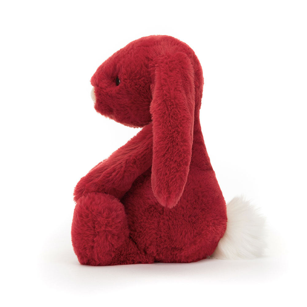 Red plush bunny toy on a white background