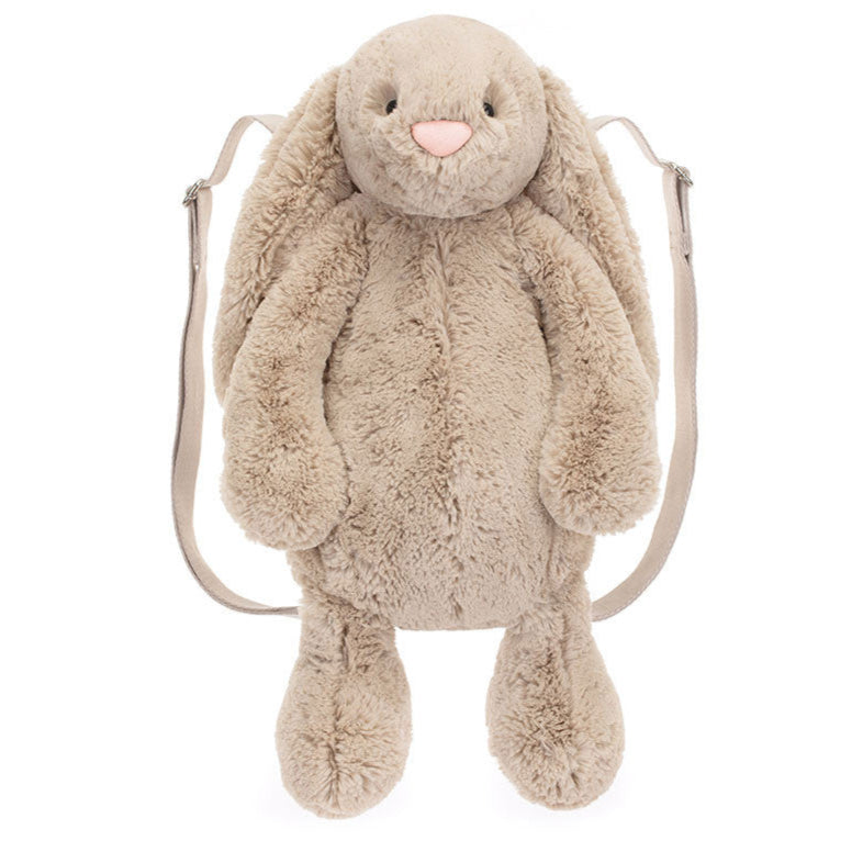 A beige plush backpack designed to look like a bunny with wide adjustable straps and a zip closure.
