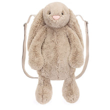 A beige plush backpack designed to look like a bunny with wide adjustable straps and a zip closure.